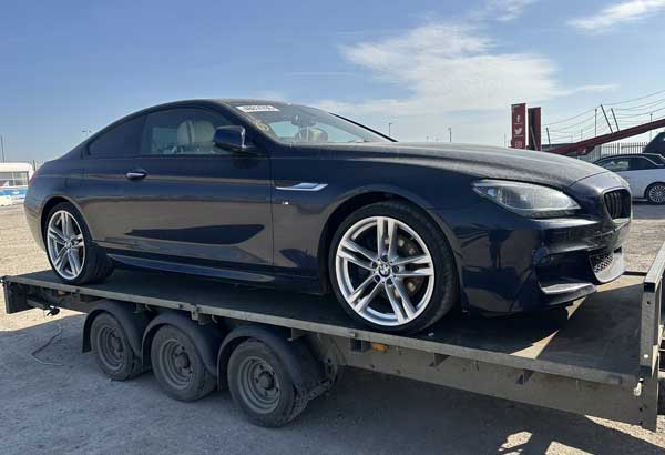 Car being transported for recovery London