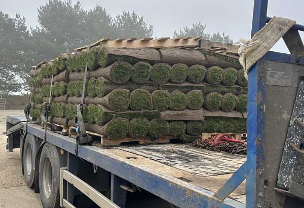 flatbed lorry transporting turf in kent